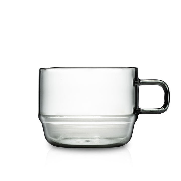 Clear glass mug with handle on a white background