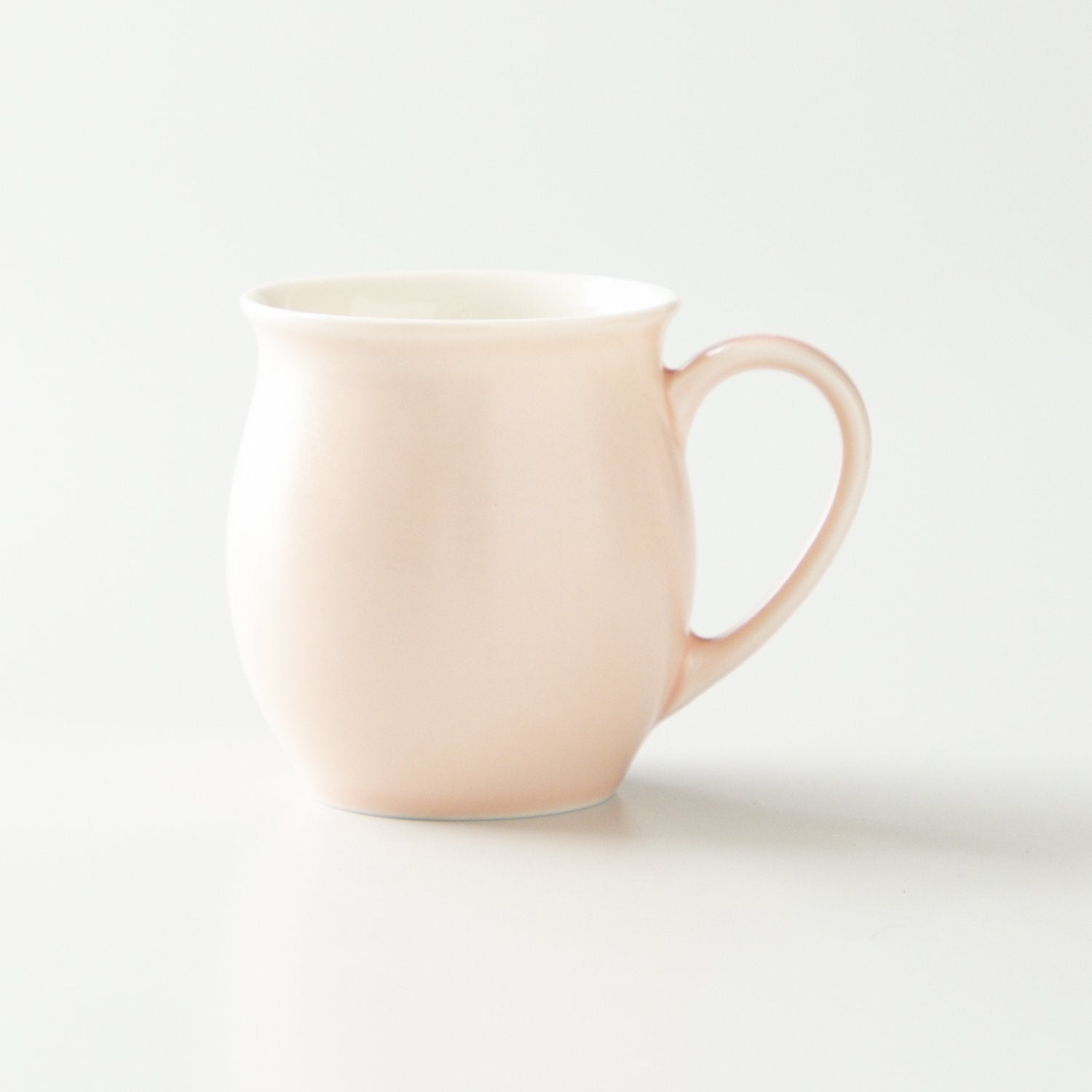 Pink mug on a white background
