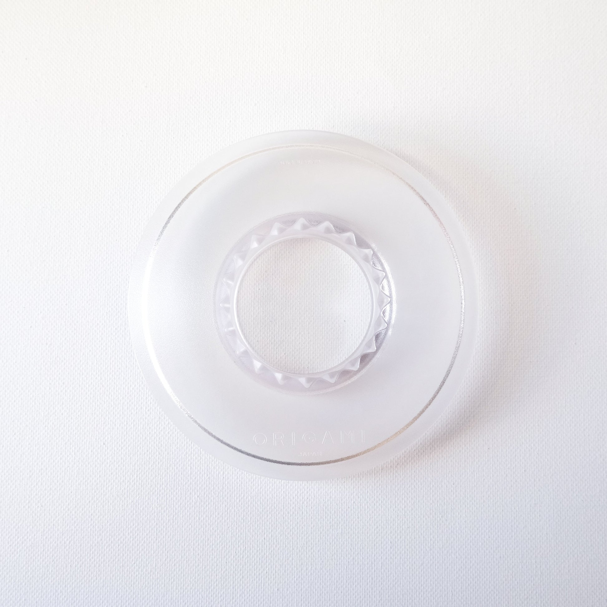 Clear resin dripper holder on a white background