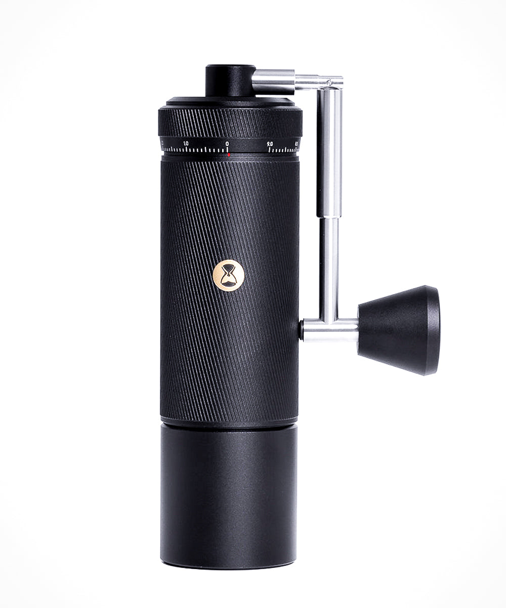 Black manual coffee grinder with brand logo on a white background