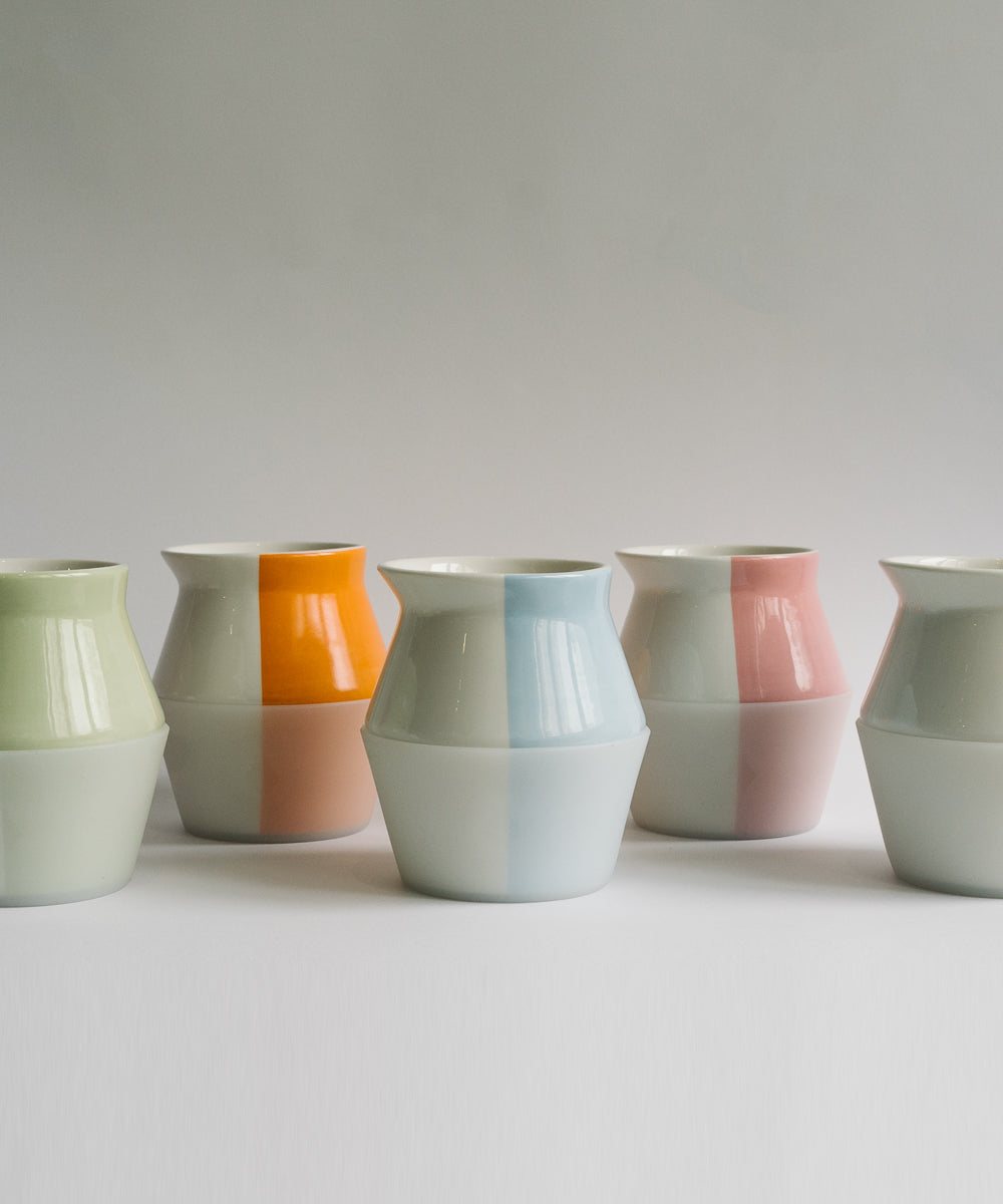 2-WayCup 330ml Refined Version set of two flavor tasting coffee cups - 5 colors shown, blue, orange, green, grey, and pink - staggered on a white surface with light grey background 