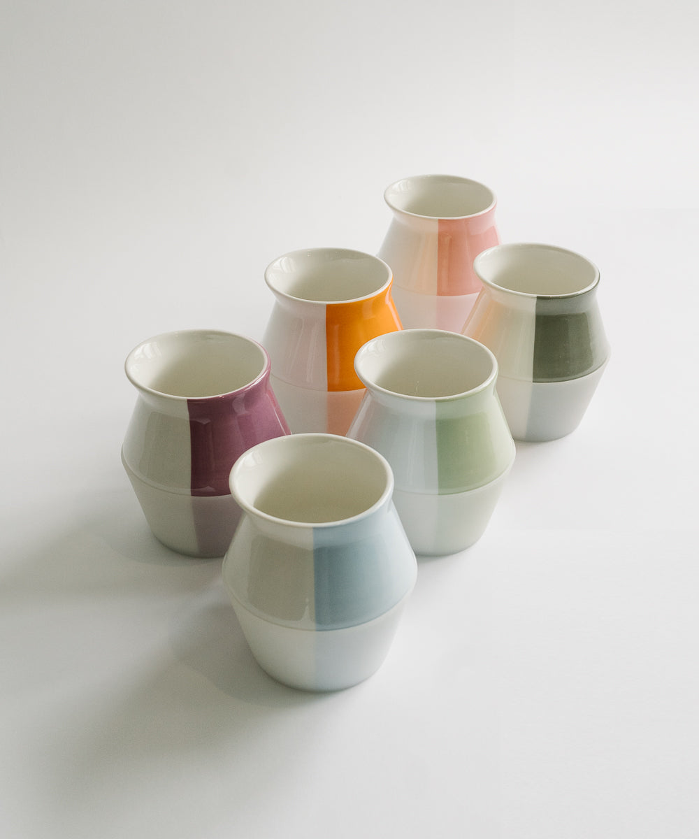 2-WayCup 330ml Refined Version set of tasting coffee cups laid out in two diagonal rows in all six colors - blue, orange, green, purple, grey, and pink - designed for two tasting experiences in one cup