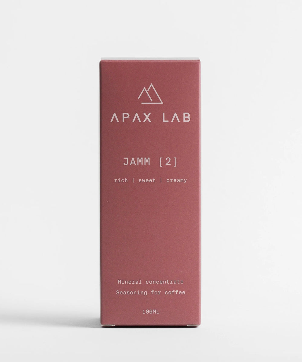 APAX Lab Jamm water mineral front view of box that bottle comes in sitting on white counter with white background