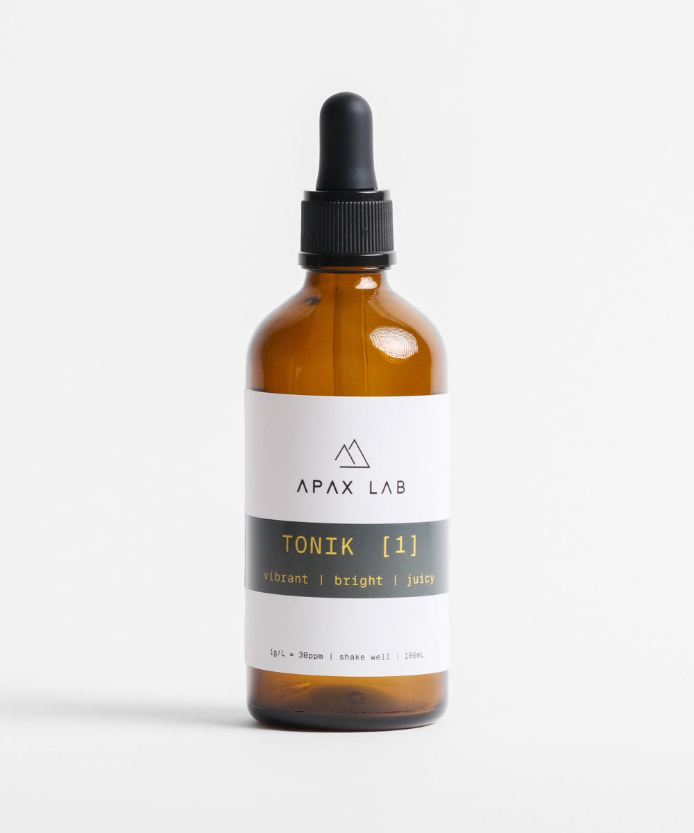 APAX Lab TONIK [1] Water Minerals Bottle front view sitting on a white counter with white background