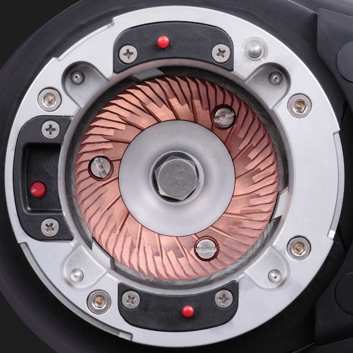 Close-up of a fiorenzato allground sense burrs assembly with metallic and copper components.