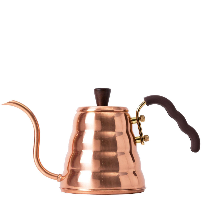 Copper kettle with wooden handle and spout on a white background