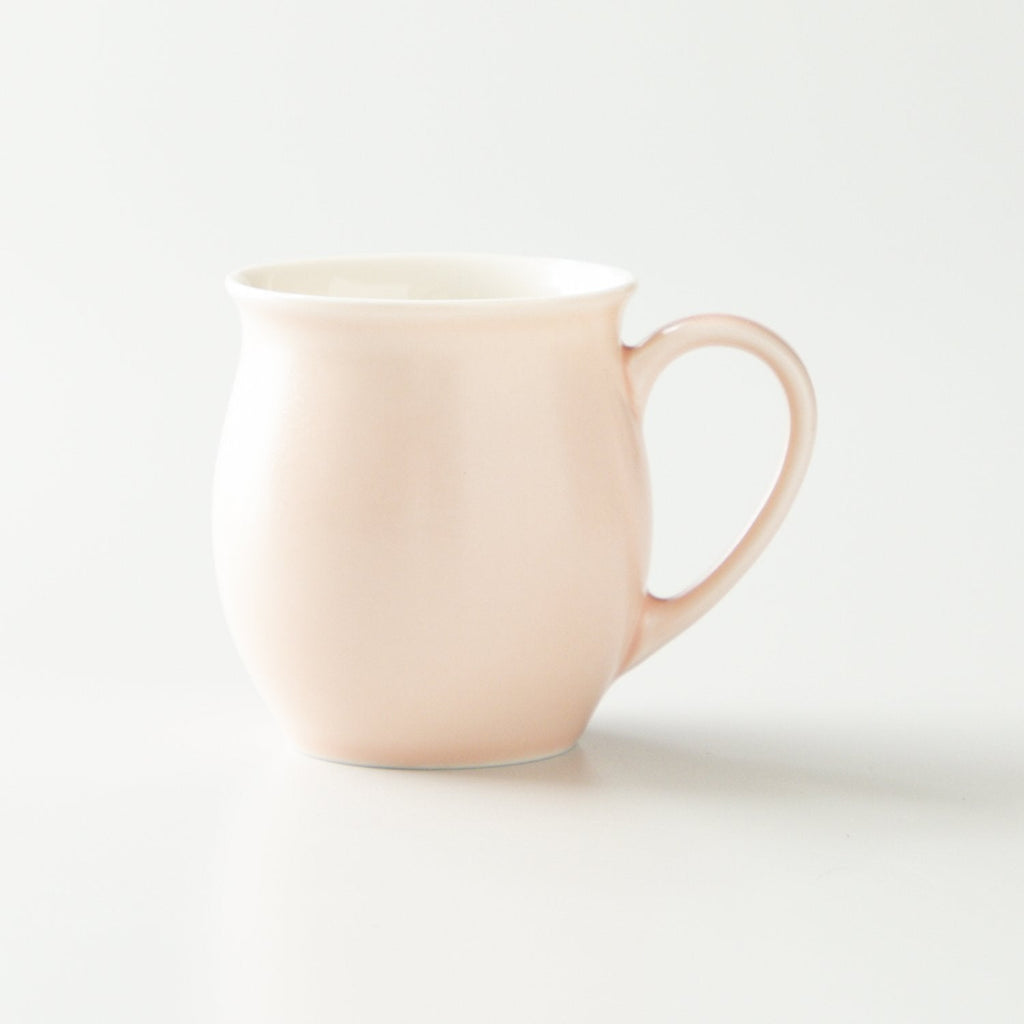 Pink mug on a white background