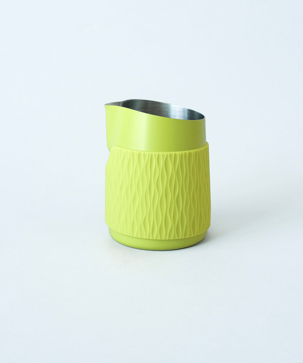 WPM Pitcher in Calamansi Mist shown from the side, featuring a sleek handleless design for latte art