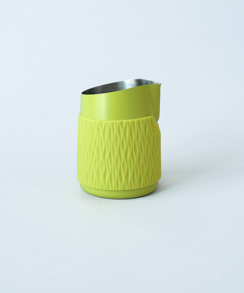WPM Pitcher in Calamansi Mist shown from the side, featuring a sleek handleless design for latte art