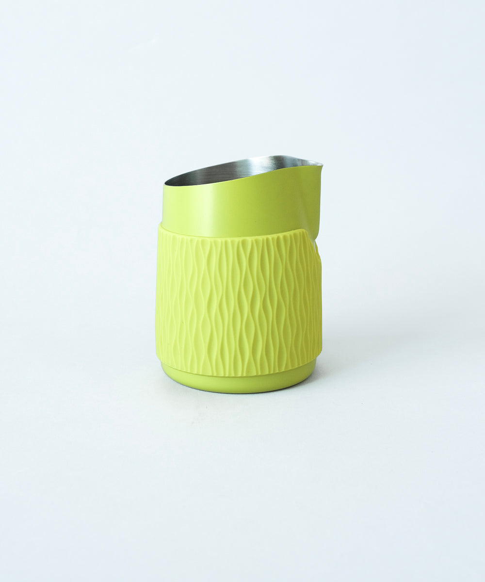 WPM Pitcher in Calamansi Mist shown from the side, featuring a sleek handleless design for latte art