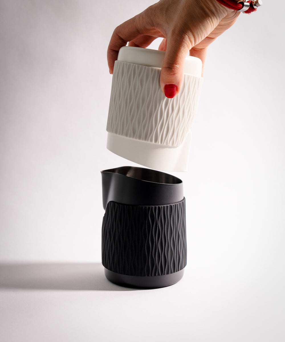 WPM Pitcher monochrome handleless latte art pitcher for precision pouring pictured in Matte White and Midnight Black