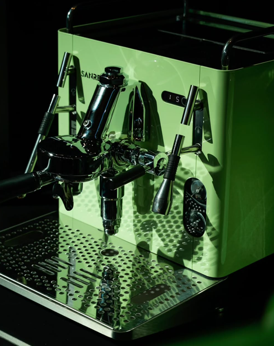 Sanremo CBUE A R  matcha Green home espresso machine with chrome details on a dark background