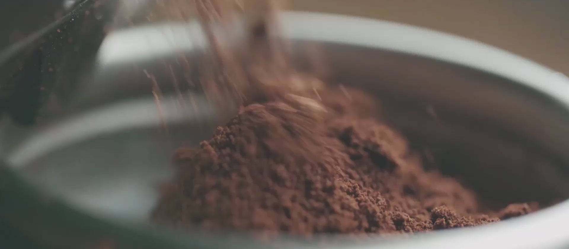 freshly ground coffee beans espresso into portafilter home espresso machine